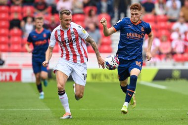 Sonny Carey #16 of Blackpool makes a break with the ball