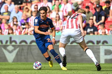 Theo Corbeanu #25 of Blackpool makes a break with the ball