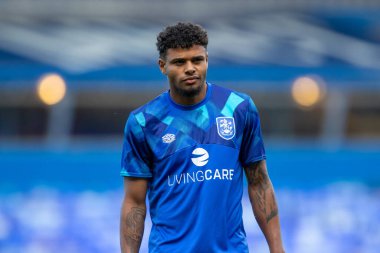 Tino Anjorin #8 of Huddersfield Town arrives at St. Andrew's Stadium ahead of this evening's game 