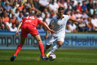 Jol Piroe (17) of Swansea City takes on Scott Wharton (16) of Blackburn Rovers   