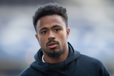 Josh Koroma #10 of Huddersfield Town arrives at St. Andrew's Stadium ahead of this evening's game 