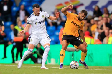 Jack Harrison #11 of Leeds United and Jonny #19 of Wolverhampton Wanderers challenge for the ball