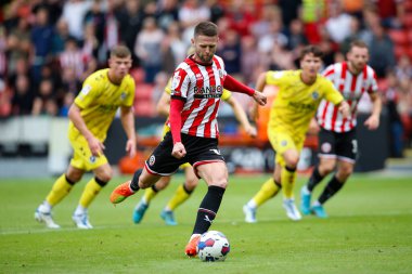 Oliver Norwood #16 of Sheffield United takes a penalty which is saved