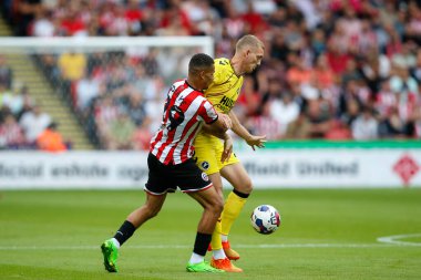 Iliman Ndiaye #29 of Sheffield United and George Saville #23 of Millwall