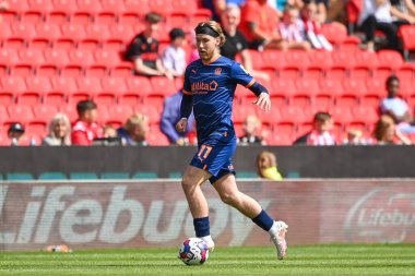 Josh Bowler #11 of Blackpool makes a break with the ball