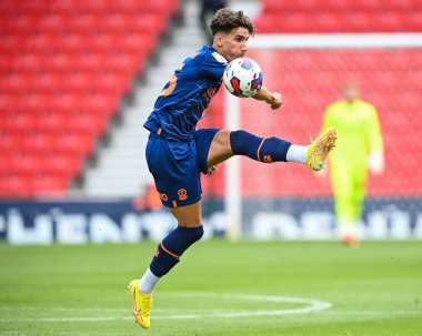 Theo Corbeanu #25 of Blackpool controls the ball