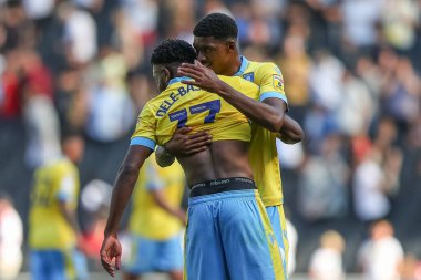 Tyreeq Bakinson #19 of Sheffield Wednesday and Fisayo Dele-Bashiru #17 of Sheffield Wednesday embrace after the final whistle