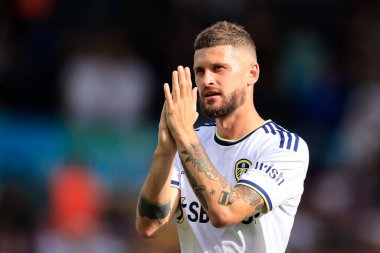 Mateusz Klich #43 of Leeds United celebrates the win and applauds the fans at the end of the game