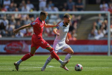 Matt Grimes (8) of Swansea City takes on Ryan Hedges (19) of Blackburn Rovers  during the game