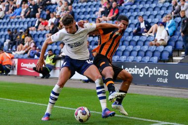 Allahyar Sayyadmanesh #9 of Hull City competes for the ball with Jordan Storey #14 of Preston North End
