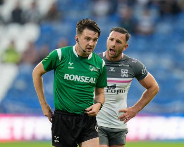 Luke Gale #7 of Hull FC speaks to referee Mr Griffiths after he shows a yellow card to Will Smith for time wasting
