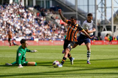 Allahyar Sayyadmanesh #9 of Hull City beats Freddie Woodman #1 of Preston North End to the ball