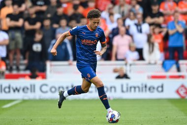 Rhys Williams #15 of Blackpool makes a break with the ball