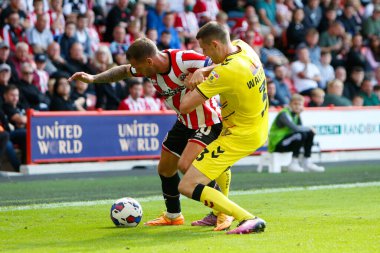 Billy Sharp #10 of Sheffield United and Murray Wallace #3 of Millwall