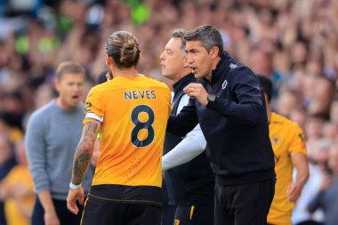 Bruno Lage the Wolverhampton Wanderers manager gives instructions to Ruben Neves #8 of Wolverhampton Wanderers  clipart