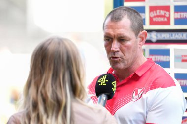 Kristian Woolf Head Coach of St Helens is interviewed by Helen Skelton for Channel 4 TV 