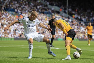 Rasmus Kristensen of Leeds United and Pedro Neto #7 of Wolverhampton Wanderers challenge for the ball