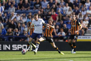 Jacob Greaves #4 of Hull City competes for the ball with Emil Riis Jakobsen #19 of Preston North End 