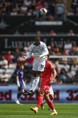 Olivier Ntcham (10) of Swansea City wins the high ball during the game