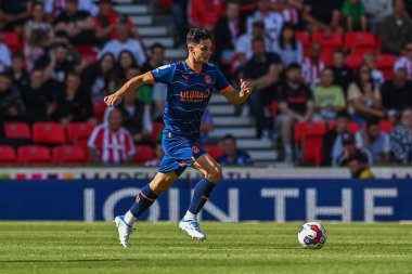 Charlie Patino #28 of Blackpool makes a break with the ball  on his debut