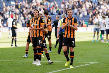 Alfie Jones #5 and Callum Elder #3 of Hull City salutes the fans after the match