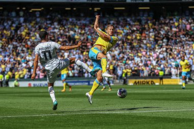 Will Vaulks #4 of Sheffield Wednesday has his shot blocked by Nathan Holland #11 of Milton Keynes Dons