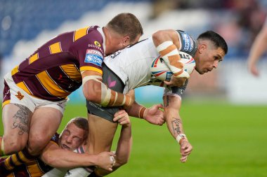 Will Smith #40 of Hull FC is held