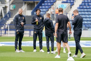 Alfie Jones #5 of Hull City and team mates inspect the pitch before the match