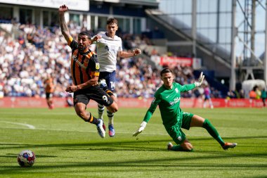 Allahyar Sayyadmanesh #9 of Hull City beats Freddie Woodman #1 of Preston North End to the ball but loses his balance and the referee waves away penalty claims