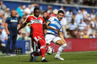 Isaiah Jones #2 of Middlesbrough and Ilias Chair #10 of QPR tussle for the ball