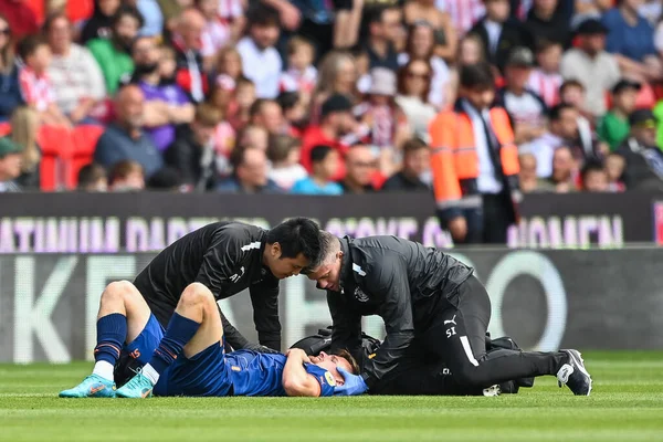 Callum Connolly #2 of Blackpool receives treatment