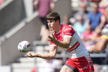 Joe Bennison #27 of St Helens  passes the ball