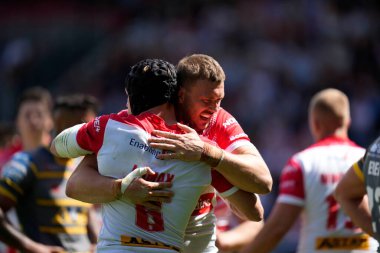 Joe Batchelor #12 of St Helens celebrates with Jonny Lomax