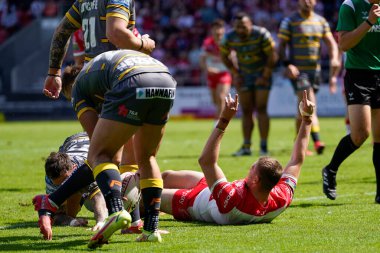 Joe Batchelor #12 of St Helens celebrates after scoring a try 
