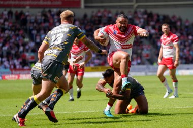 Konrad Hurrell #23 of St Helens drives for the line 