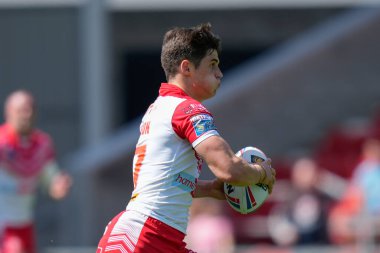 Joe Bennison #27 of St Helens makes a break through the Castleford Tigers defence