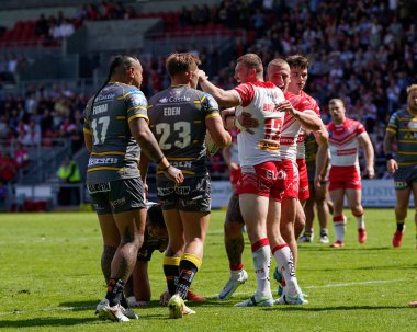 Joe Batchelor #12 of St Helens celebrates with Jake Wingfield after scoring a try 