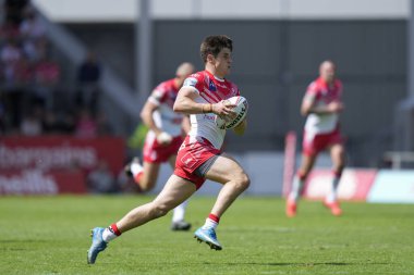 Joe Bennison #27 of St Helens makes a break through the Castleford Tigers defence