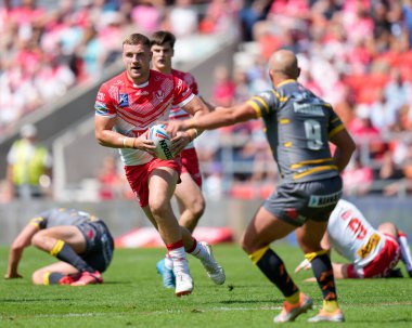 Matty Lees #10 of St Helens runs at Paul McShane #9 of Castleford Tigers