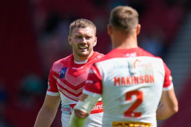 Joe Batchelor #12 of St Helens celebrates with Tommy Makinson 