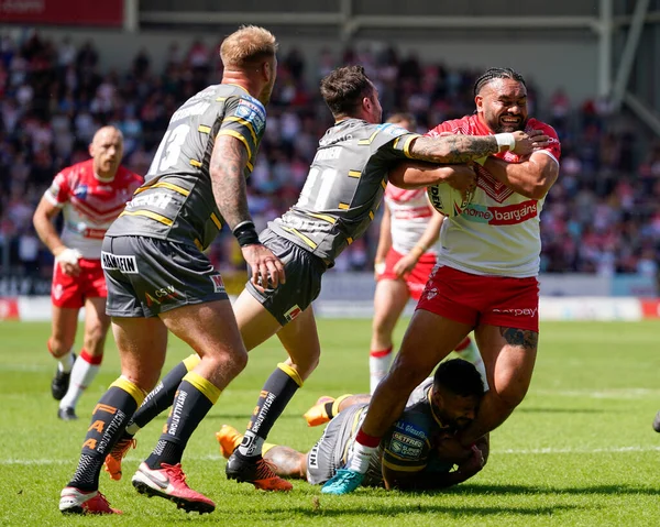 Konrad Hurrell #23 of St Helens drives for the line 