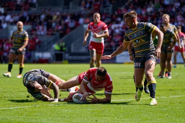 Joe Batchelor #12 of St Helens scores a try 