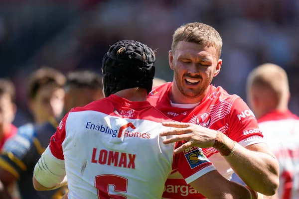 Joe Batchelor #12 of St Helens celebrates with Jonny Lomax
