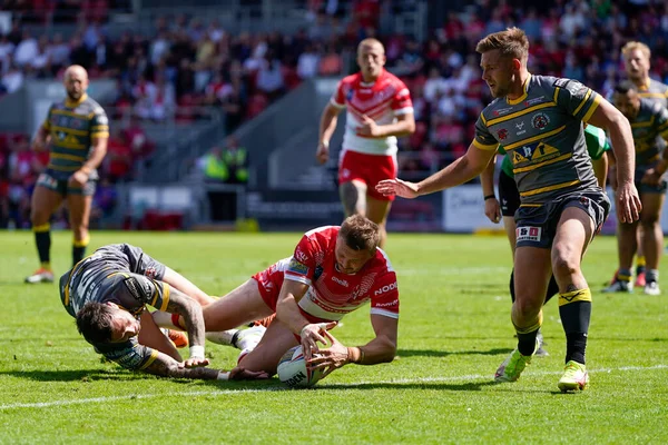 Joe Batchelor #12 of St Helens touches down for a try 