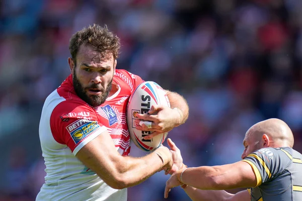Alex Walmsley #8 of St Helens breaks past Paul McShane #9 of Castleford Tigers