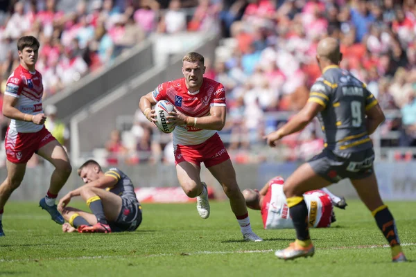 Matty Lees #10 of St Helens runs at Paul McShane #9 of Castleford Tigers