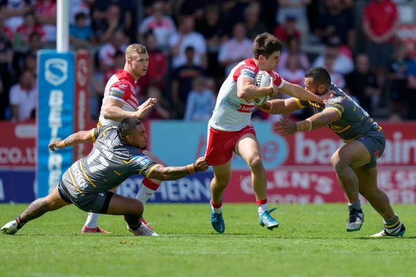 Joe Bennison #27 of St Helens breaks past Mahe Fonua #17 of Castleford Tigers