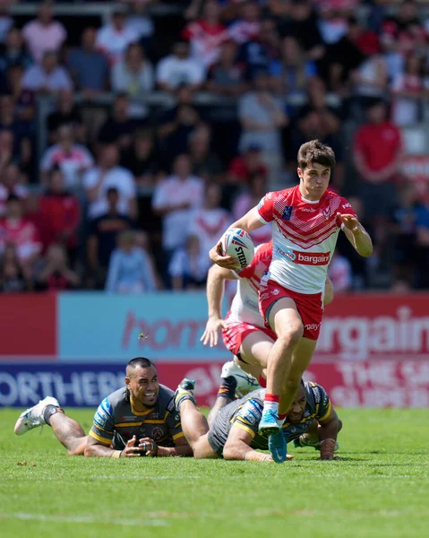 Joe Bennison #27 of St Helens breaks past Mahe Fonua #17 of Castleford Tigers