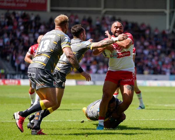 Konrad Hurrell #23 of St Helens drives for the line 