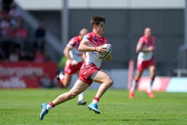 Joe Bennison #27 of St Helens makes a break through the Castleford Tigers defence